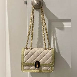Quilted chain turn lock handbag